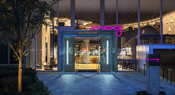 Glass entrance to the Moxy hotel